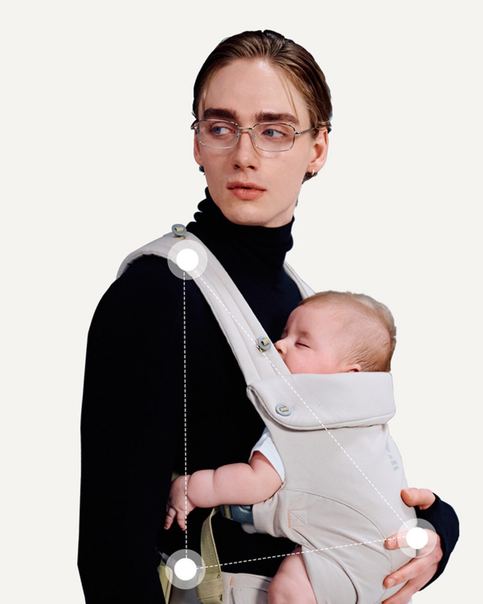 Parent carrying a baby in the CocoonGo Baby Carrier
